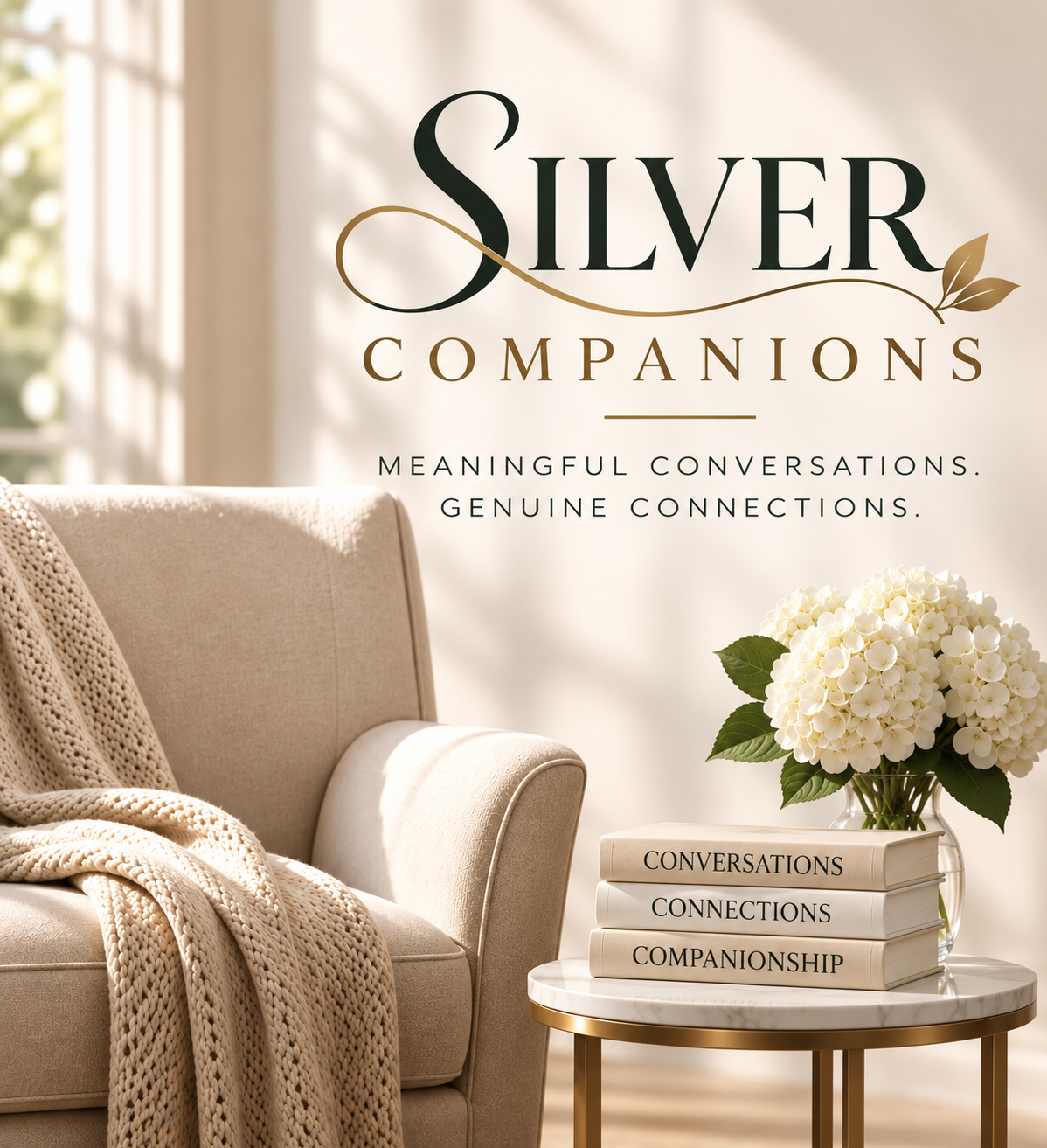 A cream armchair beside a side table with a stack of three books and white hydrangeas